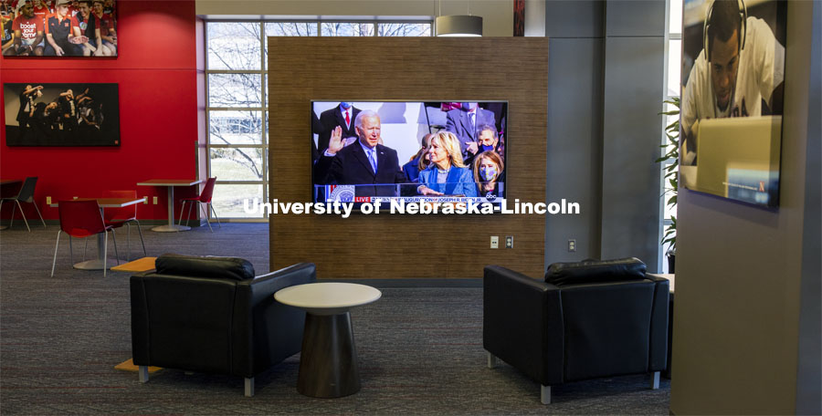 With students still on winter break, the Nebraska Union was nearly empty as the inauguration of President Biden was on a lone television screen. January 20, 2021. Photo by Craig Chandler / University Communication.