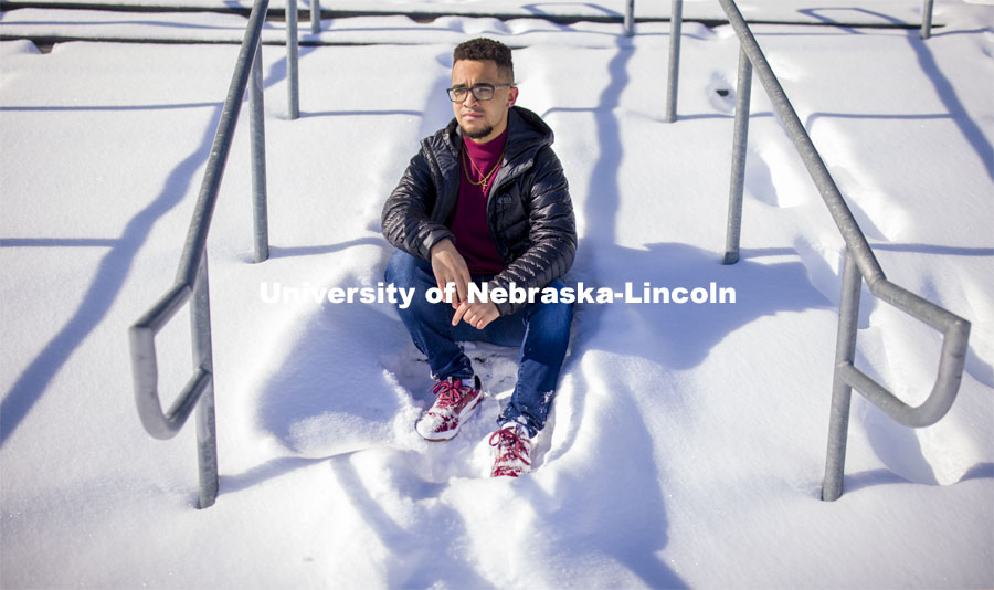 Drake Keeler is a journalism major who is leading the Daily Nebraskan's Black Lives Matter project and telling more Black stories on campus. He hopes to continue that work in his future career. Drake is a junior in journalism, specializes in sports writing. He is posing in front of Memorial Stadium in the snow. Photo for a Black History Month feature. January 27, 2021. Photo by Craig Chandler / University Communication.