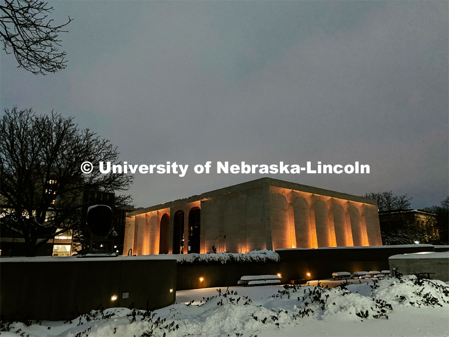 Sheldon is lit up on a snowy night on City Campus. Snow in January on City Campus. January 27, 2021. Photo by Katie Black / University Communication.