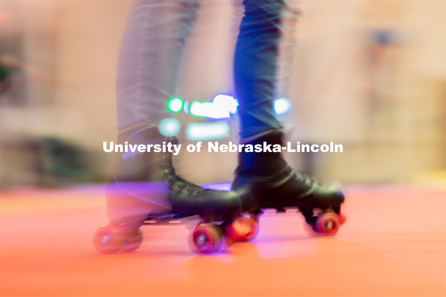 A student skates around in a circle before more students enter the skating area during the Club 80 Roller Skating Event in the Nebraska Union Ballroom on Friday, February 19, 2021, in Lincoln, Nebraska. Photo by Jordan Opp for University Communication.