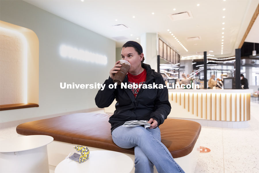 Jae Brungardt drinks her coffee at the East Union Starbucks. March 23, 2021. Photo by Craig Chandler / University Communication.