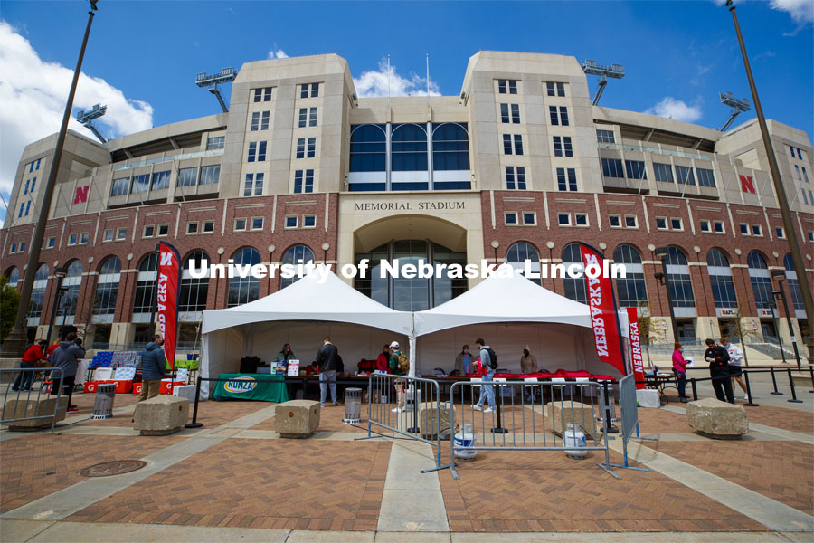 Vaccine clinic in the Coliseum with a free food and goodies tent outside. April 20, 2021. Photo by Craig Chandler / University Communication.