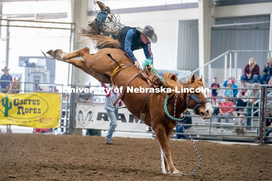Nebraska’s Sam Florell competes in the saddle bronc riding event at the Nebraska Cornhusker College Rodeo at the Lancaster Event Center. April 24, 2021. Photo by Jordan Opp for University Communications.