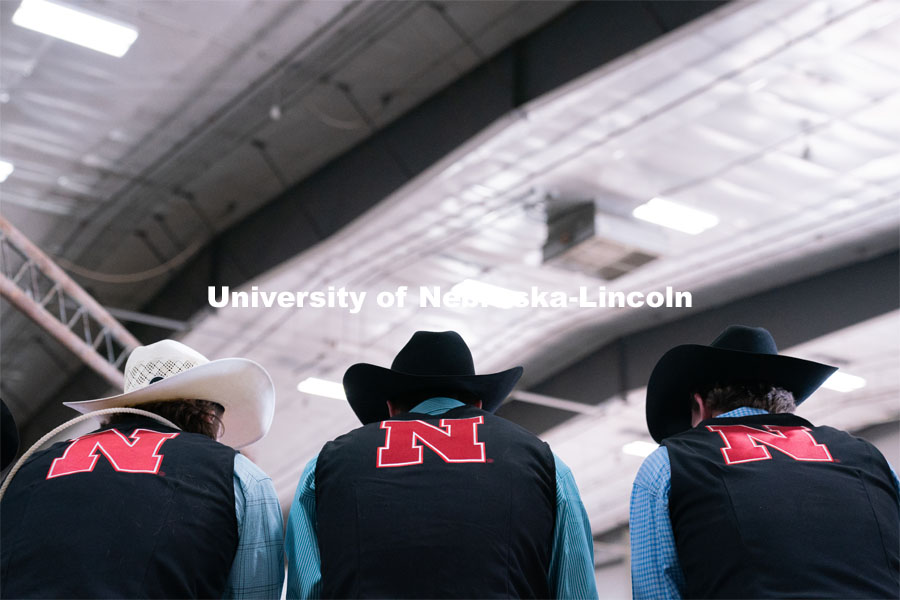 Members of the University of Nebraska rodeo team watches barrel racing event at the Nebraska Cornhusker College Rodeo at the Lancaster Event Center. April 24, 2021. Photo by Jordan Opp for University Communications.