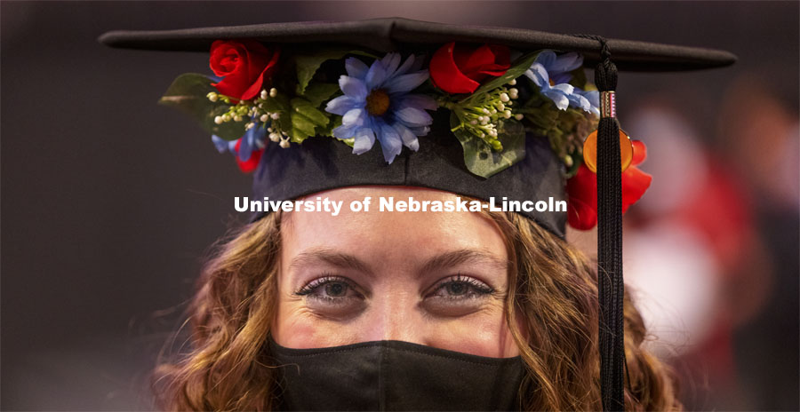 Alexa Allen wore flowers around her mortar board while collecting her master’s degree in educational administration. Graduate Commencement at Pinnacle Bank Arena. May 7, 2021. Photo by Craig Chandler / University Communication.