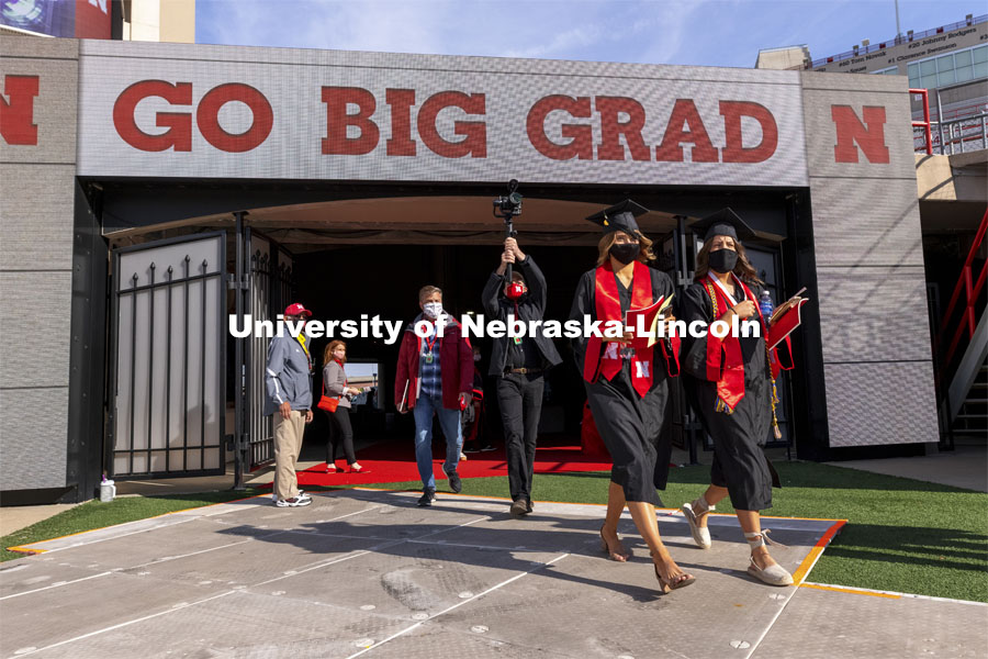 Graduates step on the field Saturday morning at the UNL Commencement in Memorial Stadium. May 8, 2021. Photo by Craig Chandler / University Communication.