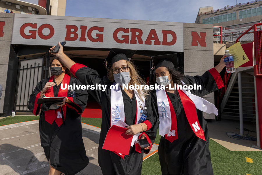 Claire Wiens and Adrienne McDowell cheer as they step on the field Saturday morning. UNL Commencement in Memorial Stadium. May 8, 2021. Photo by Craig Chandler / University Communication.