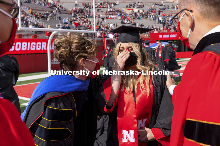 Julia Boogaard with Mike Boehm, Tiffany Heng-Moss and Ronnie Green. UNL Commencement in Memorial Stadium. May 8, 2021. Photo by Craig Chandler / University Communication.