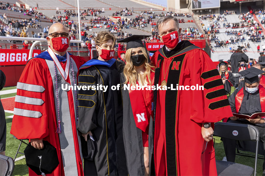 Julia Boogaard with Mike Boehm, Tiffany Heng-Moss and Ronnie Green. UNL Commencement in Memorial Stadium. May 8, 2021. Photo by Craig Chandler / University Communication.
