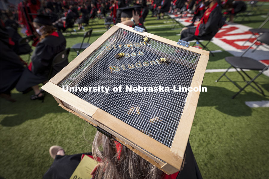 Courtney Wallner decorated her mortar board with live bees. UNL Commencement in Memorial Stadium. May 8, 2021. Photo by Craig Chandler / University Communication.
