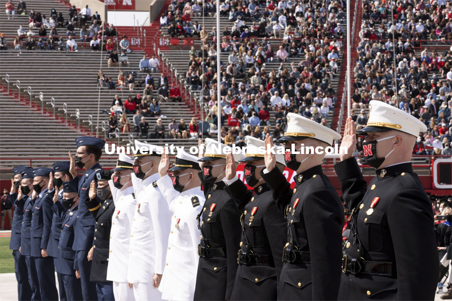 Air Force, Navy Marine and Army ROTC cadets recite the oath of enlistment at the beginning of the morning commencement. The cadets then changed into regalia to graduate with their colleges. The university conferred a record 3,594 degrees during the May commencement ceremonies. UNL Commencement in Memorial Stadium. May 8, 2021. Photo by Craig Chandler / University Communication.