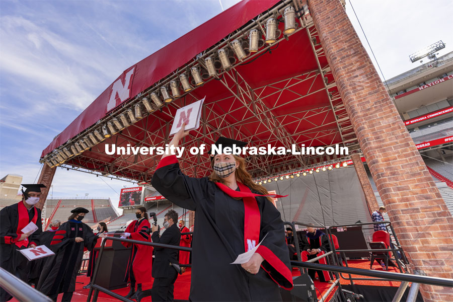 Jessica Nogelmeier gestures after receiving her architecture degree. UNL Commencement in Memorial Stadium. May 8, 2021. Photo by Craig Chandler / University Communication.