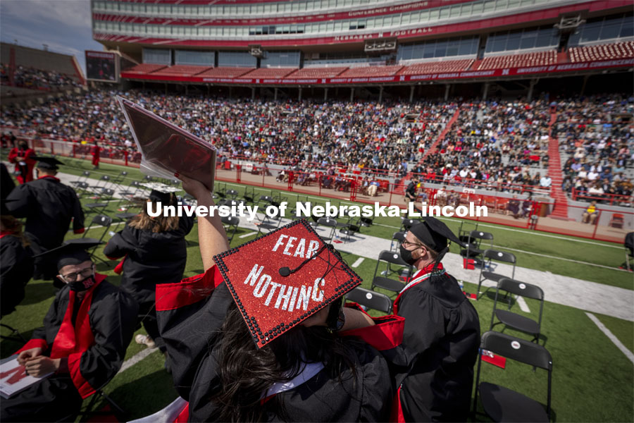 Adrienne McDowell waves to family and friends after receiving her CoJMC degree. UNL Commencement in Memorial Stadium. May 8, 2021. Photo by Craig Chandler / University Communication.