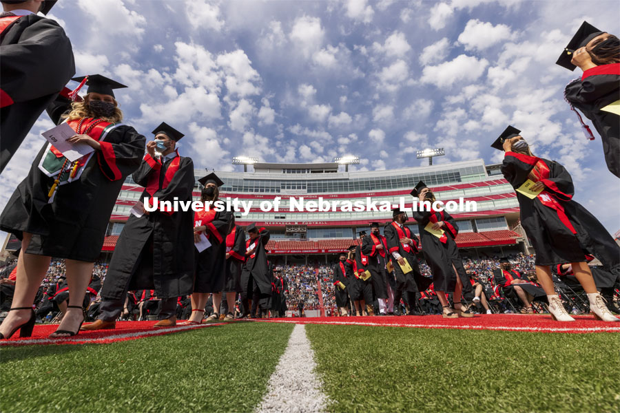 Students line up in the center of the field to receive their diplomas. UNL Commencement in Memorial Stadium. May 8, 2021. Photo by Craig Chandler / University Communication.