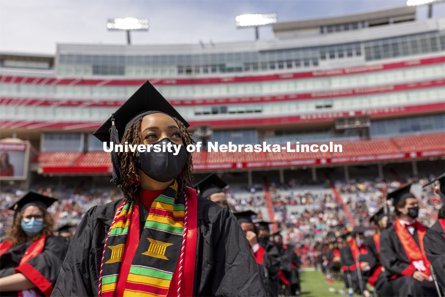 Alissa Clarke watches a video on the screens during the morning commencement. UNL Commencement in Memorial Stadium. May 8, 2021. Photo by Craig Chandler / University Communication.
