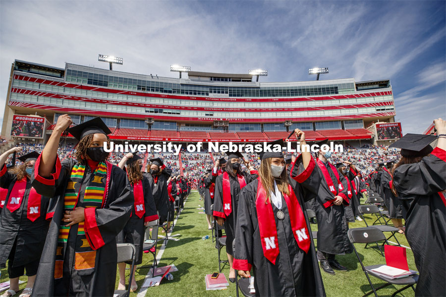 Alissa Clarke and Destiney Chitrodom turn their tassels at the end of the commencement. UNL Commencement in Memorial Stadium. May 8, 2021. Photo by Craig Chandler / University Communication.
