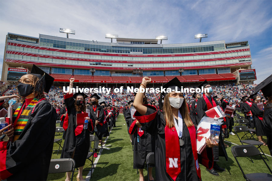 Alissa Clarke and Destiney Chitrodom celebrate after turning their tassels at the end of the commencement. UNL Commencement in Memorial Stadium. May 8, 2021. Photo by Craig Chandler / University Communication.
