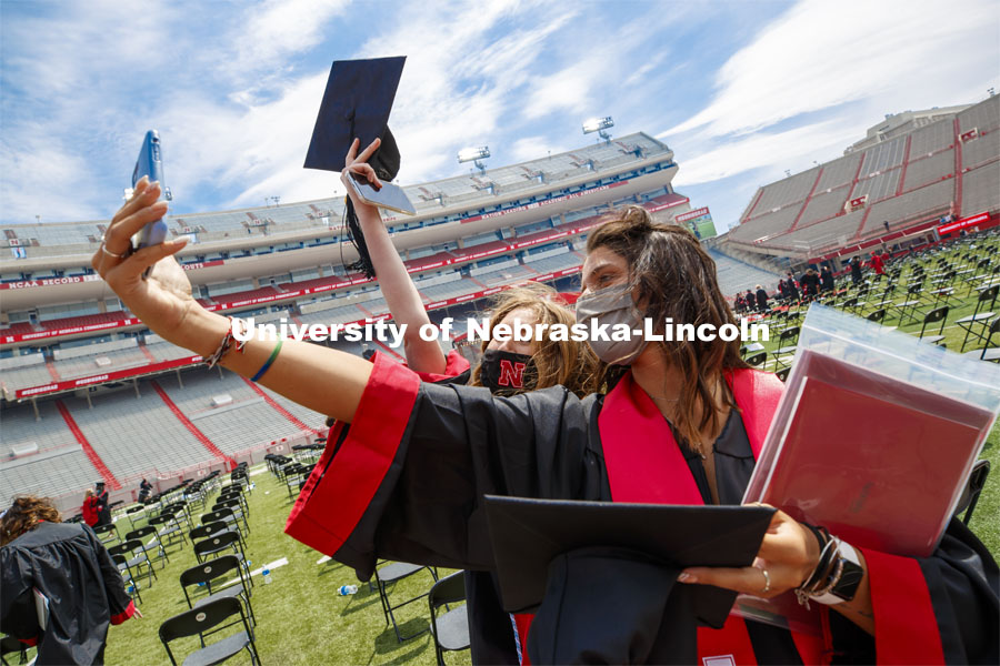 Rebecca Stolpa takes a selfie with Abigail Down after the morning commencement. UNL Commencement in Memorial Stadium. May 8, 2021. Photo by Craig Chandler / University Communication.