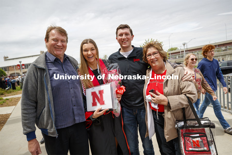 Erika Swenson and family pose for a picture following commencement. UNL Commencement in Memorial Stadium. May 8, 2021. Photo by Craig Chandler / University Communication.