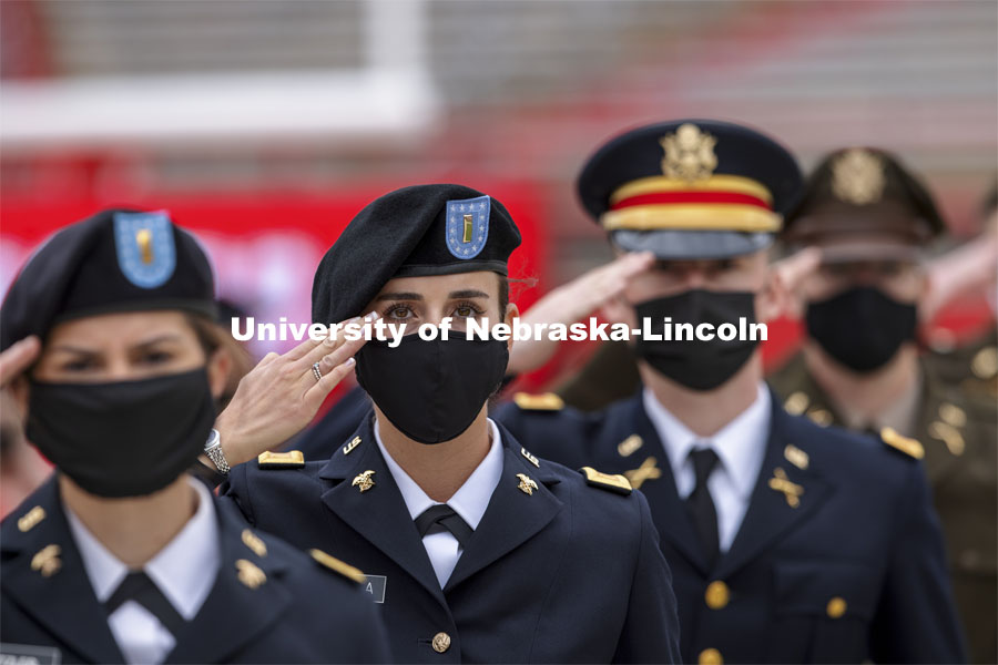 New Army Second Lieutenants including Taylor Butalla salute the color guard at the beginning of the second commencement. The former ROTC cadets then recited the Oath and Enlistment and then changed into regalia to graduate with their colleges. The university conferred a record 3,594 degrees during the May commencement ceremonies. UNL Commencement in Memorial Stadium. May 8, 2021. Photo by Craig Chandler / University Communication.