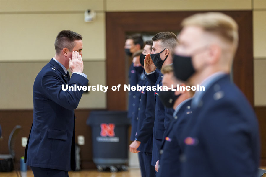 Lieutenant Colonel C. J. Zaworski salutes a newly commissioned Second Lieutenant during the Air Force ROTC Commissioning Ceremony in the East Union Great Plains Room. May 10, 2021. Photo by Craig Chandler / University Communication.  