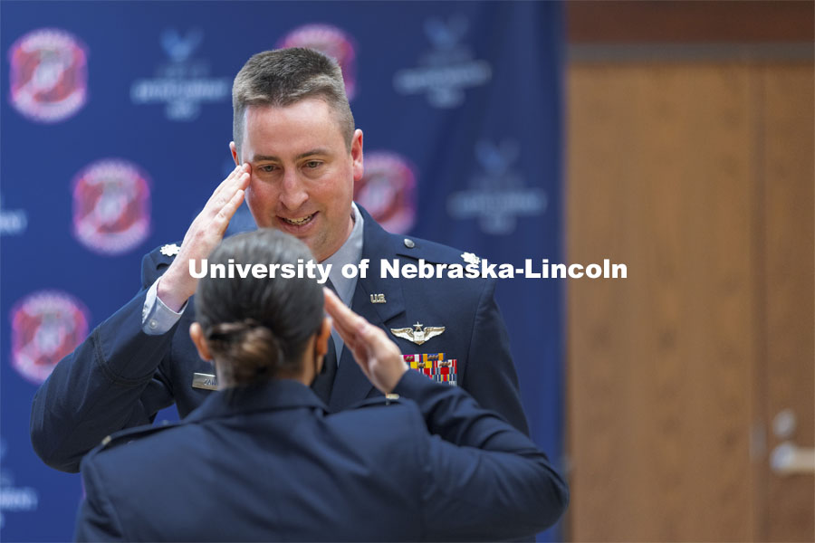Lieutenant Colonel C. J. Zaworski salutes a newly commissioned Second Lieutenant during the Air Force ROTC Commissioning Ceremony in the East Union Great Plains Room. May 10, 2021. Photo by Craig Chandler / University Communication.  