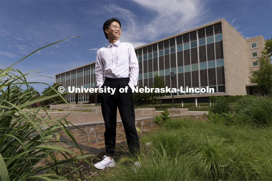 Zhaozhou Dai, a senior journalism major, poses outside of Andersen Hall for an ASEM recruiting story. May 26, 2021. Photo by Craig Chandler / University Communication.  