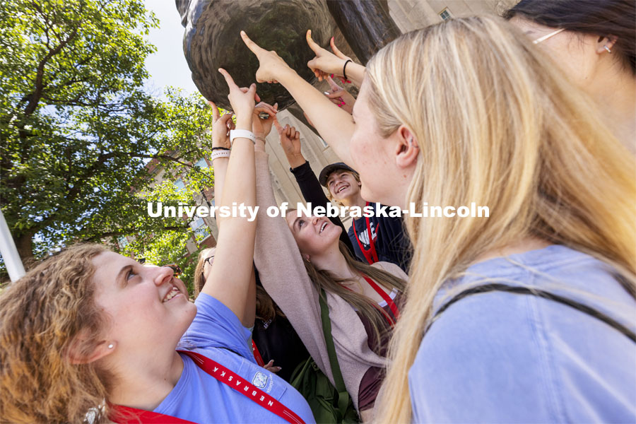 A group of students touch Archie’s foot for good luck as each group made photos for social media. New Student Enrollment began this week and will continue through July 9. June 2, 2021. Photo by Craig Chandler / University Communication.