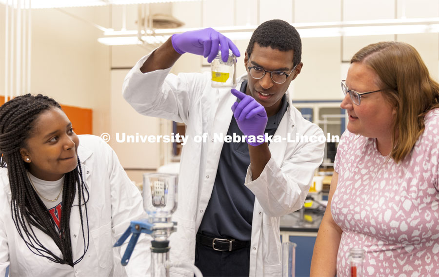 McNair scholar Seth Caines, center, and summer research scholar Moriah Brown from Howard University look over water samples with Professor Shannon Bartlet-Hunt. They are researching textiles as a source of microplastic fibers to Nebraska streams. June 22, 2021. Photo by Craig Chandler / University Communication.