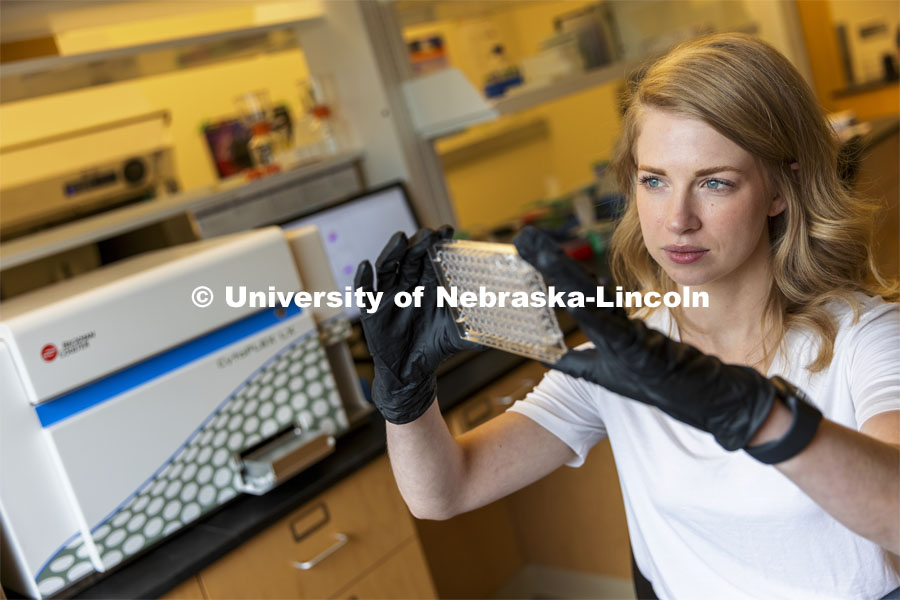 Graduate student Kari Heck places samples into a flow Cytometry analyzer in the Morrison Center for Virology. Nebraska Center for Biotechnology. June 25, 2021. Photo by Craig Chandler / University Communication.