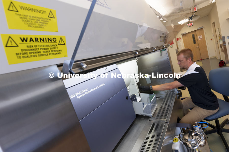Flow Cytometry Service Center Manager, Dirk Anderson works with samples in a flow Cytometry sorter in the Morrison Center for Virology. Nebraska Center for Biotechnology. June 25, 2021. Photo by Craig Chandler / University Communication.