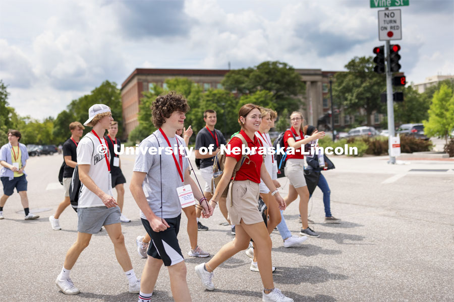 A New Student Enrollment tour group crosses campus at 14th and Vine streets. New Student Enrollment tours on campus. June 30, 2021. Photo by Craig Chandler / University Communication.