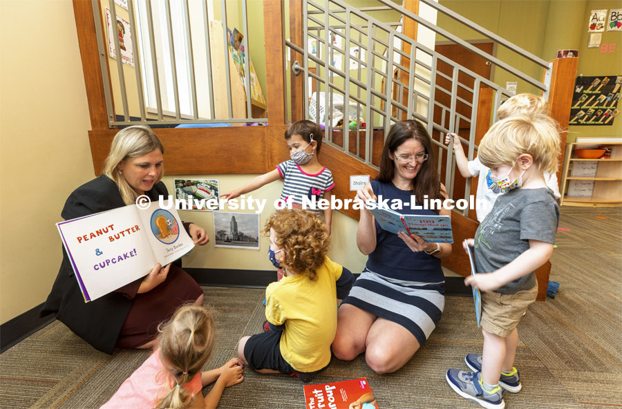 Holly Hatton-Bowers, left, and Carrie Clark read to the children at the UNL Children’s Center. July 15, 2021. Photo by Craig Chandler / University Communication.