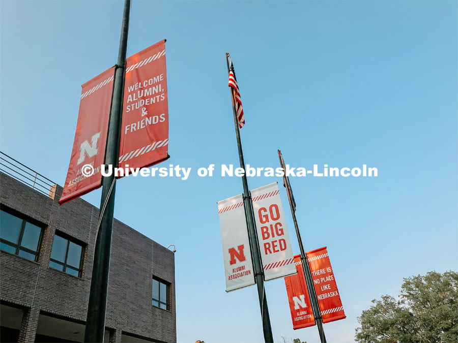 N banners on the flagpoles outside of the Nebraska Union on City Campus. July 21, 2021. Photo by Katie Black / University Communication.