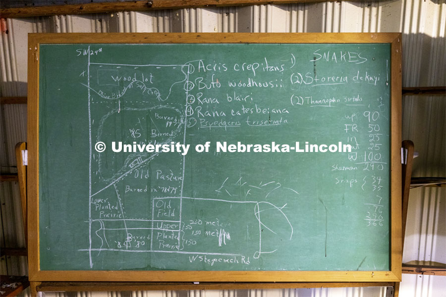 A chalkboard shows a diagram of the Reller Prairie Field Station. The history Reller Prairie Field Station south of Martell, Nebraska. August 3, 2021. Photo by Craig Chandler / University Communication.