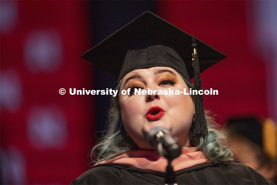Elaina Matthews, a 2020 Master of Music graduate, sings the National Anthem at the Undergraduate Commencement at Pinnacle Bank Arena. August 14, 2021. Photo by Craig Chandler / University Communication.