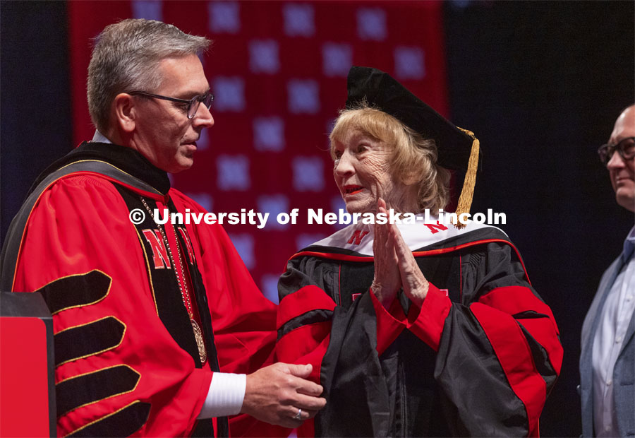 Leta Powell Drake, local television pioneer and Husker alumna, is congratulated by Chancellor Ronnie Green. Drake was presented with an honorary Doctor of Humane Letters during the undergraduate ceremony. Undergraduate Commencement at Pinnacle Bank Arena. August 14, 2021. Photo by Craig Chandler / University Communication.