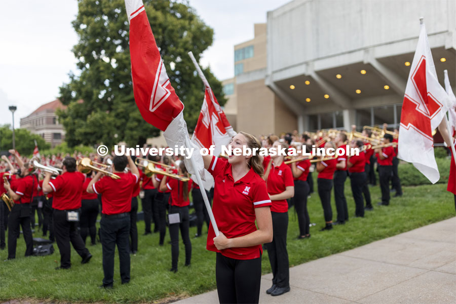 Haley Petri, a senior from Omaha, chants “Go Big Red” the completion of the band’s warm-up concert. Big Red Welcome week featured the Cornhusker Marching Band Exhibition. The band gave their warm-up concert outside of Kimball Recital Hall and then marched to the stadium. Lightning then caused the show to be cancelled. August 20, 2021. Photo by Craig Chandler / University Communication.