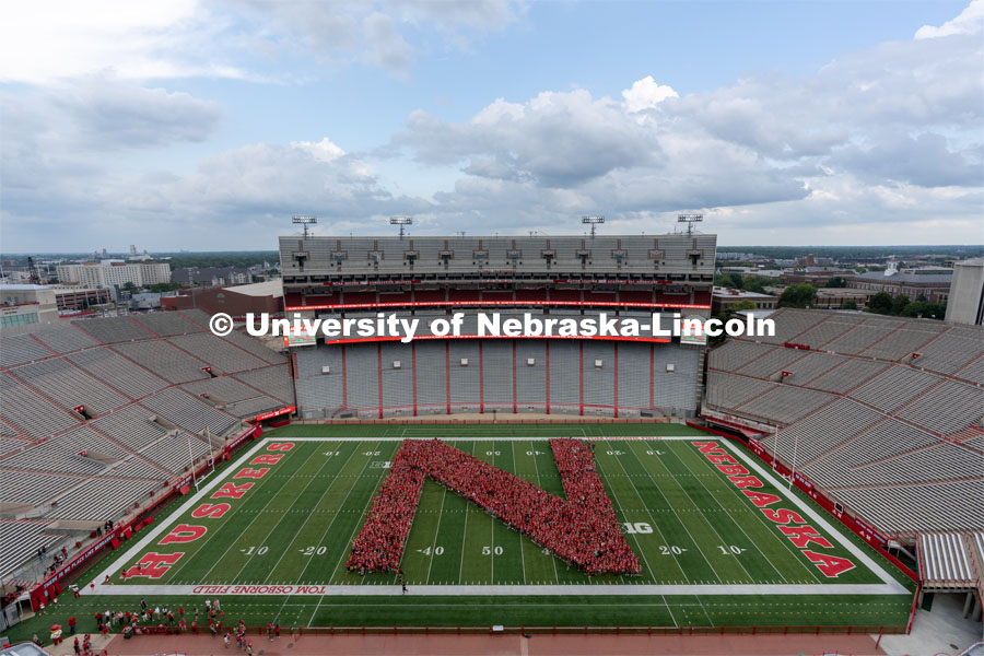 Part of the Big Red Welcome is the formation of an N on the field in Memorial Stadium made up of the class of 2025 freshmen students. First year students tunnel walk. August 20, 2021. Photo by Jordan Opp / University Communication.