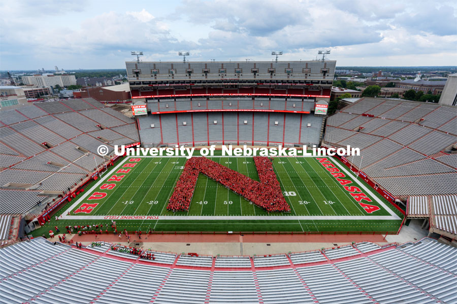 Part of the Big Red Welcome is the formation of an N on the field in Memorial Stadium made up of the class of 2025 freshmen students. First year students tunnel walk. August 20, 2021. Photo by Jordan Opp / University Communication.