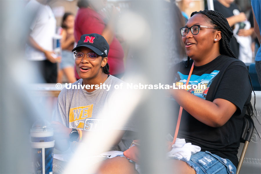 Students smile as they play Mario Kart against each other during the Big Red Welcome Street Festival. The Street Festival was held on East Memorial Stadium Loop between the College of Business and Memorial Stadium. August 22, 2021. Photo by Jordan Opp for University Communication.