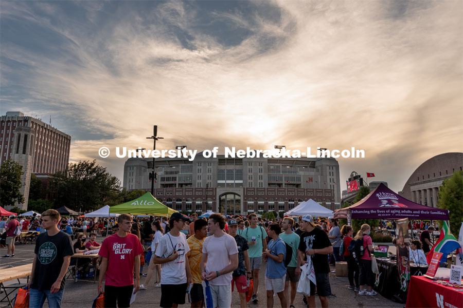 Students walk around East Memorial Stadium Loop during the Big Red Welcome Street Festival. The Street Festival was held on East Memorial Stadium Loop between the College of Business and Memorial Stadium. August 22, 2021. Photo by Jordan Opp for University Communication.