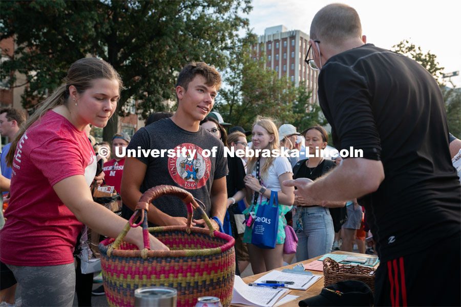 Students talk to local clubs and businesses during the Big Red Welcome Street Festival. The Street Festival was held on East Memorial Stadium Loop between the College of Business and Memorial Stadium. August 22, 2021. Photo by Jordan Opp for University Communication.