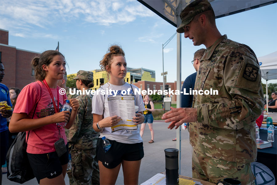 Students talk to an Army recruiter during the Big Red Welcome Street Festival. The Street Festival was held on East Memorial Stadium Loop between the College of Business and Memorial Stadium. August 22, 2021. Photo by Jordan Opp for University Communication.