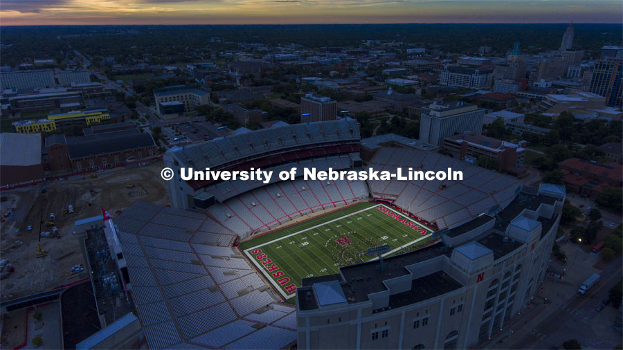 Cornhusker Marching Band begins the first day of classes as the sun comes up over the stadium. First day of classes for fall semester. August 23, 2021. Photo by Craig Chandler / University Communication.