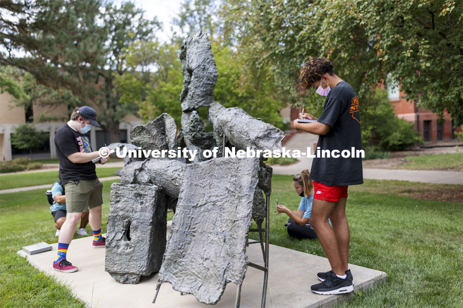 Kal-El Morman and the rest of the Architecture 210 class were sketching sculptures outside of Architecture Hall to study mass and volume and how the shapes interplayed. First day of classes for fall semester. August 23, 2021. Photo by Craig Chandler / University Communication.