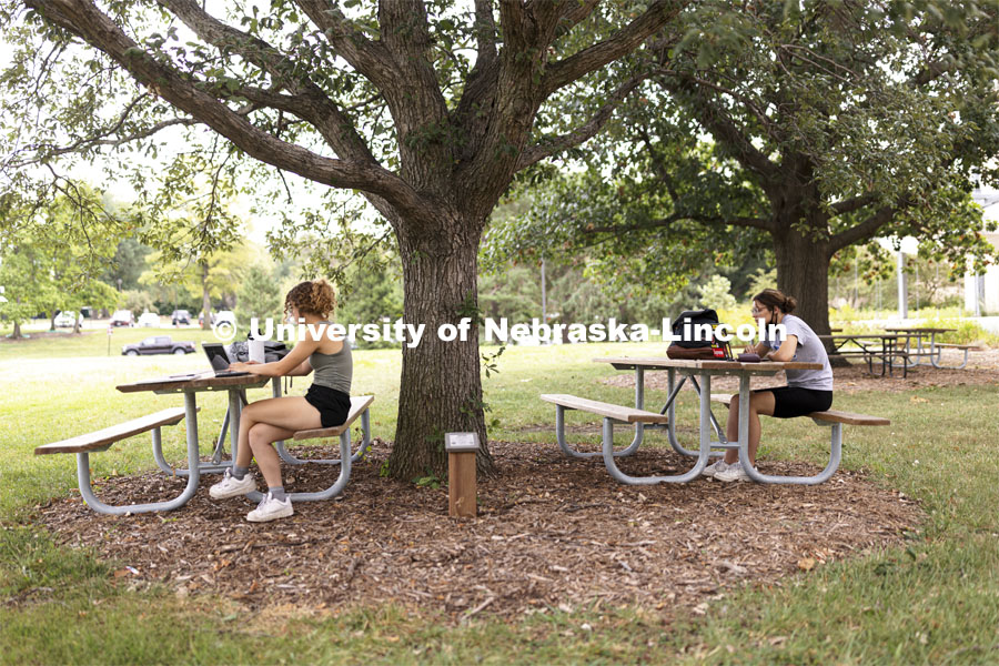 Studying under the trees outside Hardin Hall. First day of classes for fall semester. August 23, 2021. Photo by Craig Chandler / University Communication.