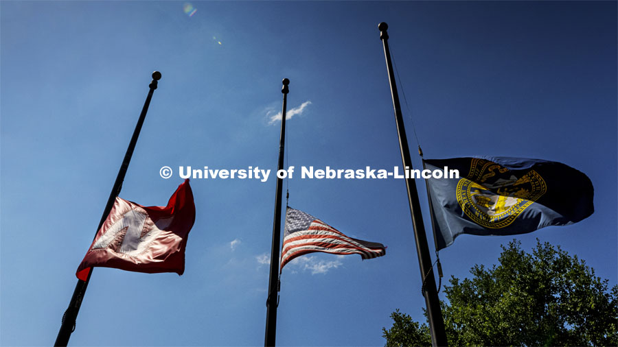 Flags fly at half staff in memory of the 13 service members killed in Kabul on August 26. August 27, 2021. Photo by Craig Chandler / University Communication.