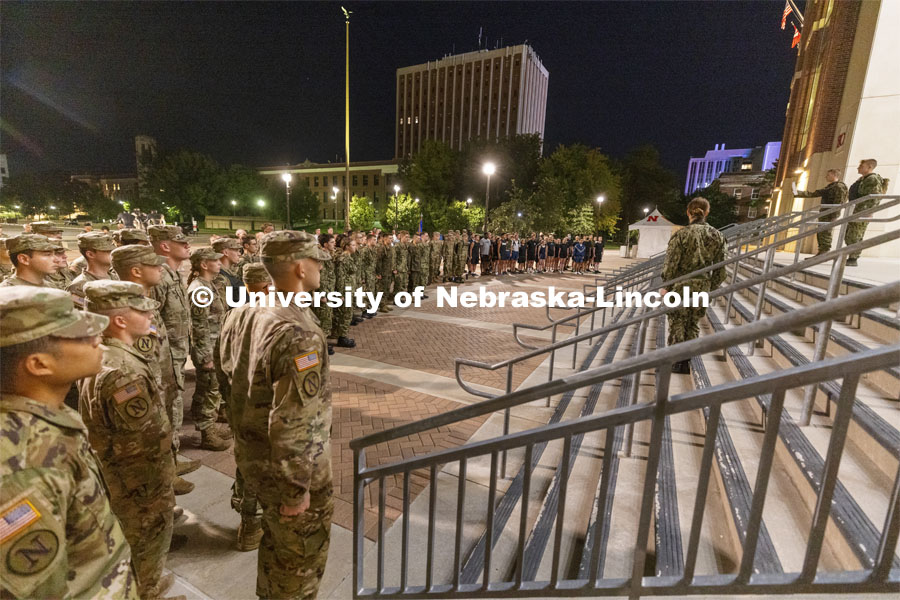 UNL ROTC cadets and Lincoln first responders stand in formation on the east stadium steps to listen to comments before the run. The cadets ran the steps of Memorial Stadium to honor those who died on 9/11. Each cadet ran more than 2,000 steps. September 9, 2021. Photo by Craig Chandler / University Communication.
