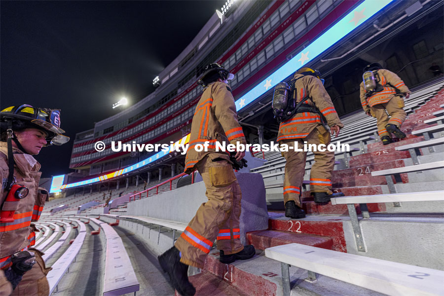 Lincoln Fire Department members run the west stadium steps. UNL ROTC cadets and Lincoln first responders run the steps of Memorial Stadium to honor those who died on 9/11. Each cadet ran more than 2,000 steps. September 9, 2021. Photo by Craig Chandler / University Communication.